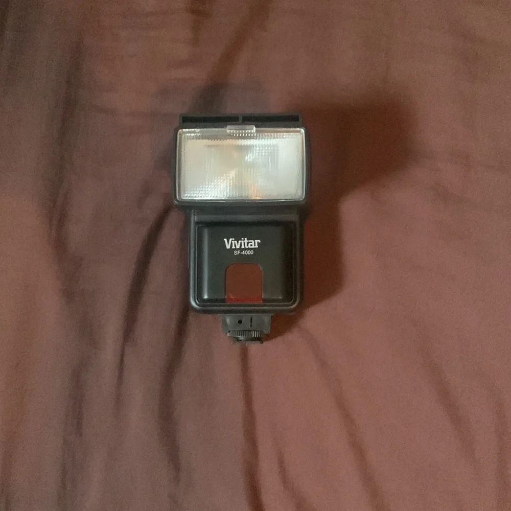 Selling a Canon Rebel T100 Camera with a lot of accessories and a backpack.